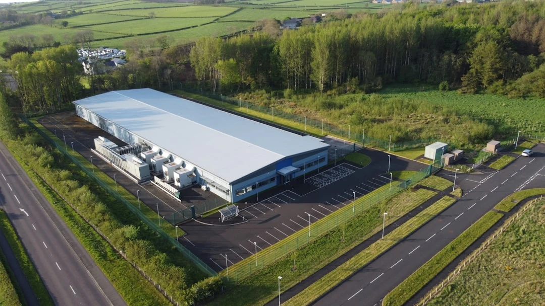 Exterior of a modern data centre facility, illustrating mission-critical infrastructure for a geotechnical article on foundations and settlement.